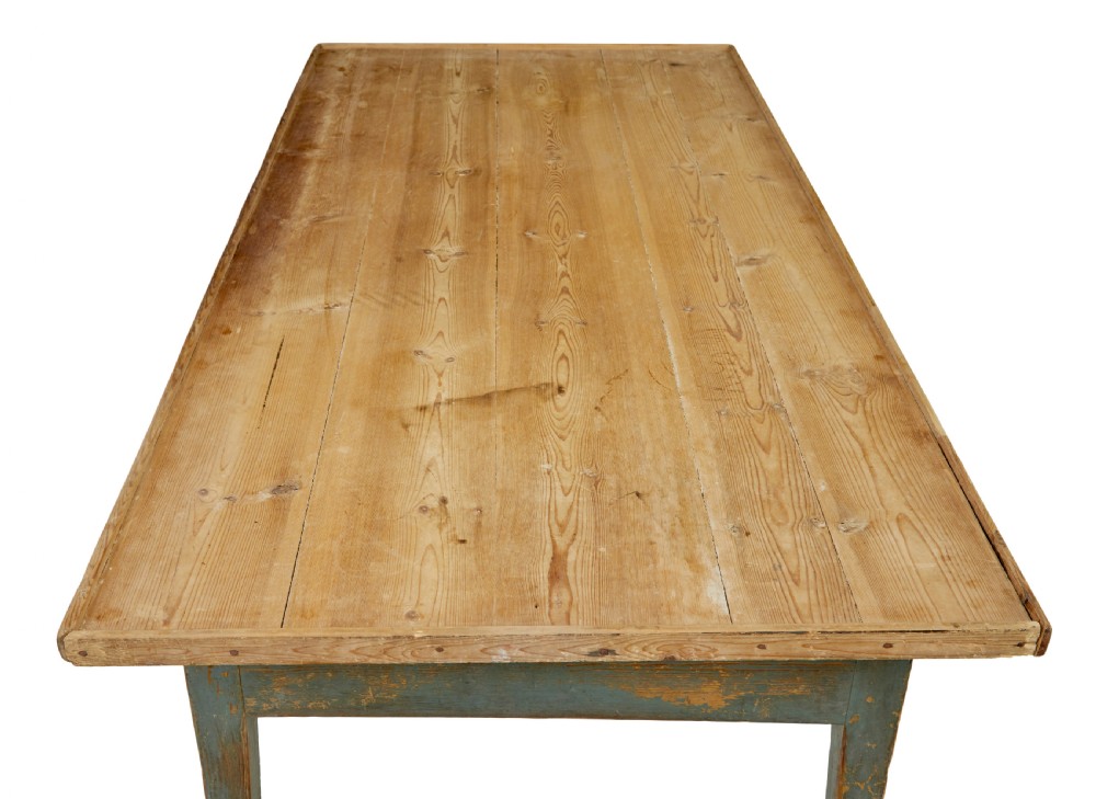 A mid 19th-century Swedish pine bakers table featuring two drawers, tapered square legs, and a distressed blue painted finish with a scrubbed wooden top. View VIII