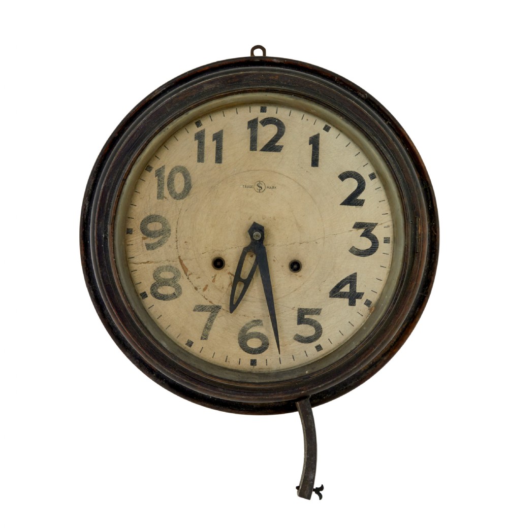 A circular vintage Japanese wall clock featuring a dark wooden bezel and an off-white dial with black Arabic numerals. View II