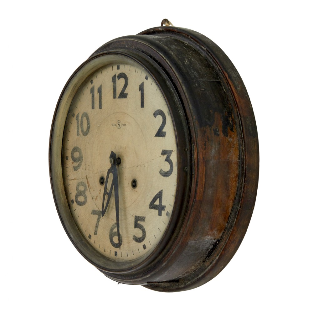A circular vintage Japanese wall clock featuring a dark wooden bezel and an off-white dial with black Arabic numerals. View IV