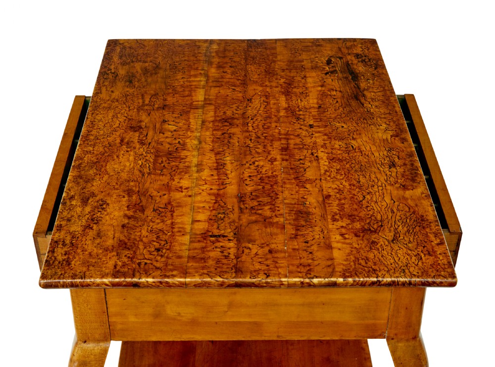 A 19th-century fruitwood and alder occasional table featuring curved legs, a single drawer with a brass handle, a lower shelf, and a figured wood top. View III