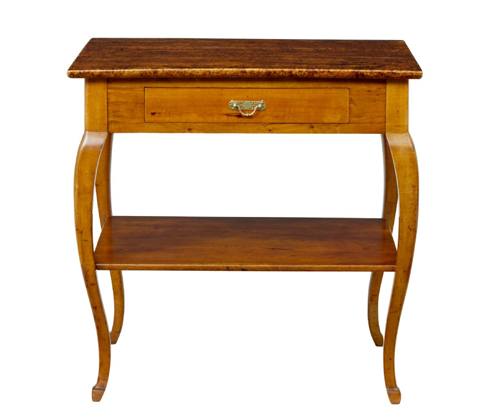 A 19th-century fruitwood and alder occasional table featuring curved legs, a single drawer with a brass handle, a lower shelf, and a figured wood top. View VII