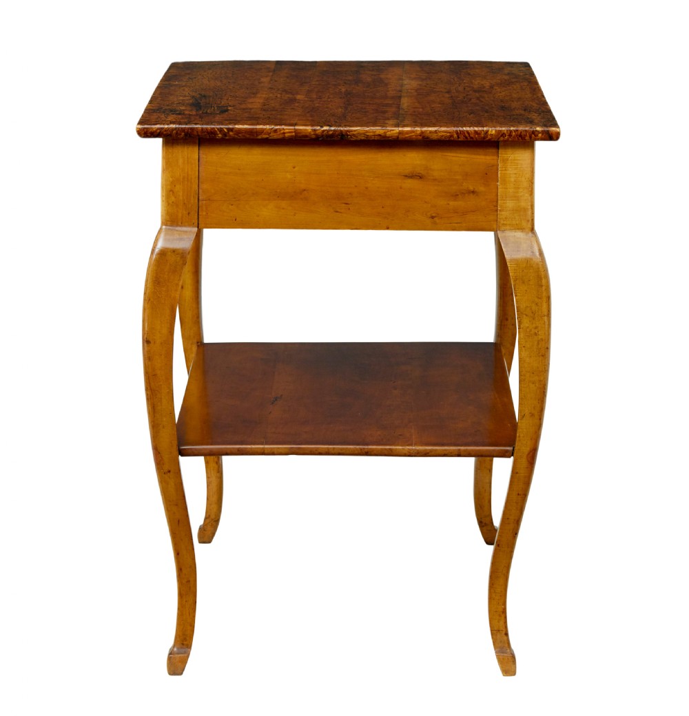 A 19th-century fruitwood and alder occasional table featuring curved legs, a single drawer with a brass handle, a lower shelf, and a figured wood top. View VIII