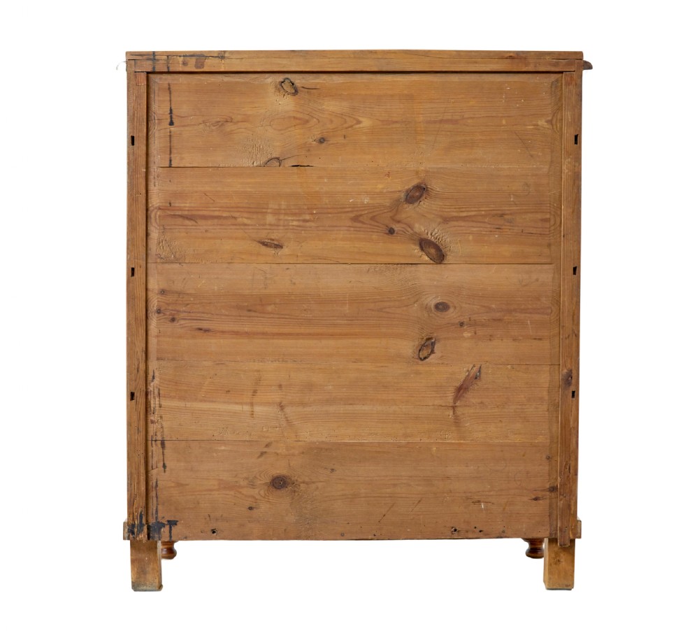 A 19th-century Swedish double-door cupboard crafted from highly figured golden birch timber with turned front feet. View V