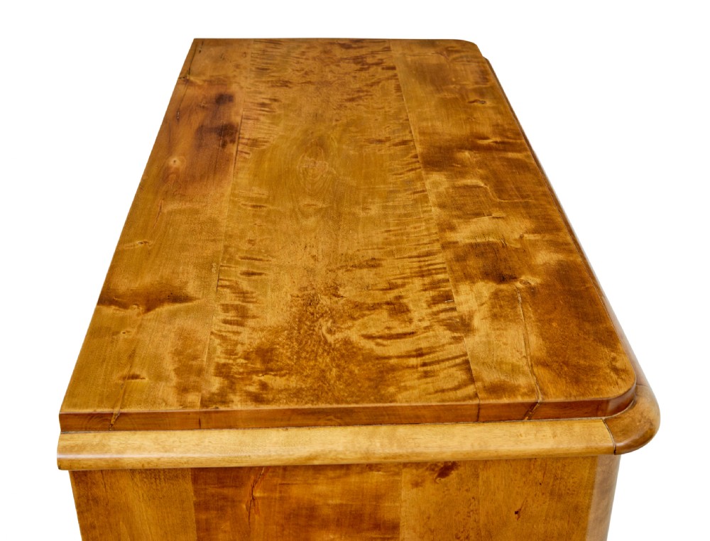 A 19th-century Swedish double-door cupboard crafted from highly figured golden birch timber with turned front feet. View IX