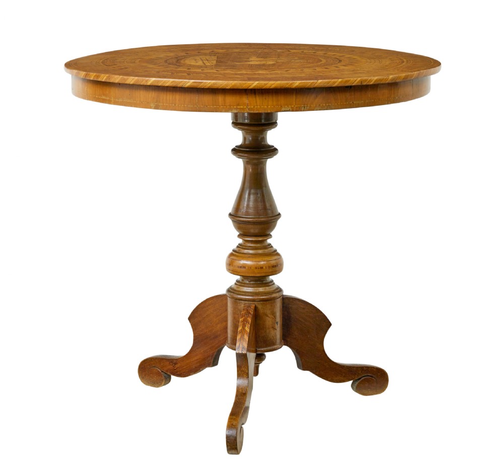 A 19th-century round walnut pedestal table featuring intricate Sorrento marquetry inlay on the tabletop and a turned column supported by a tripod base.