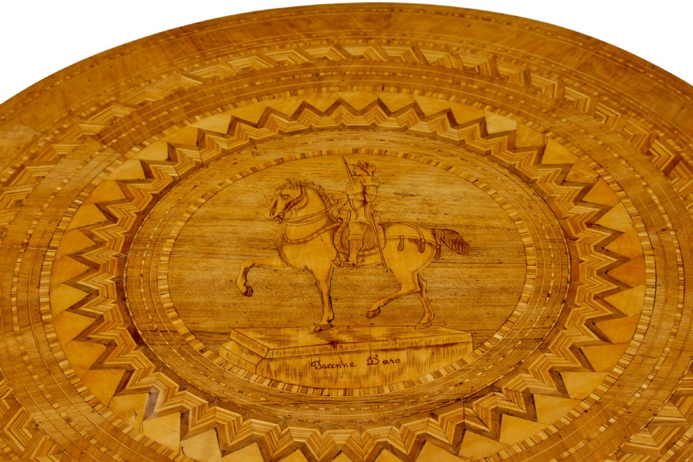 A 19th-century round walnut pedestal table featuring intricate Sorrento marquetry inlay on the tabletop and a turned column supported by a tripod base. View V
