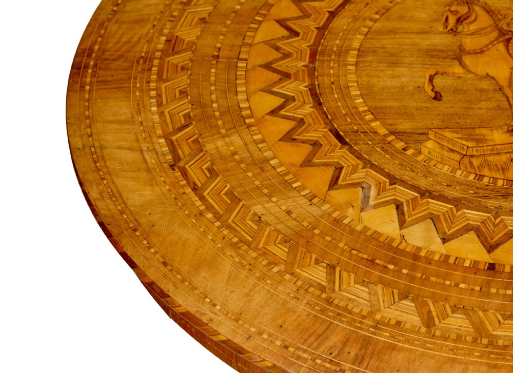 A 19th-century round walnut pedestal table featuring intricate Sorrento marquetry inlay on the tabletop and a turned column supported by a tripod base. View VI