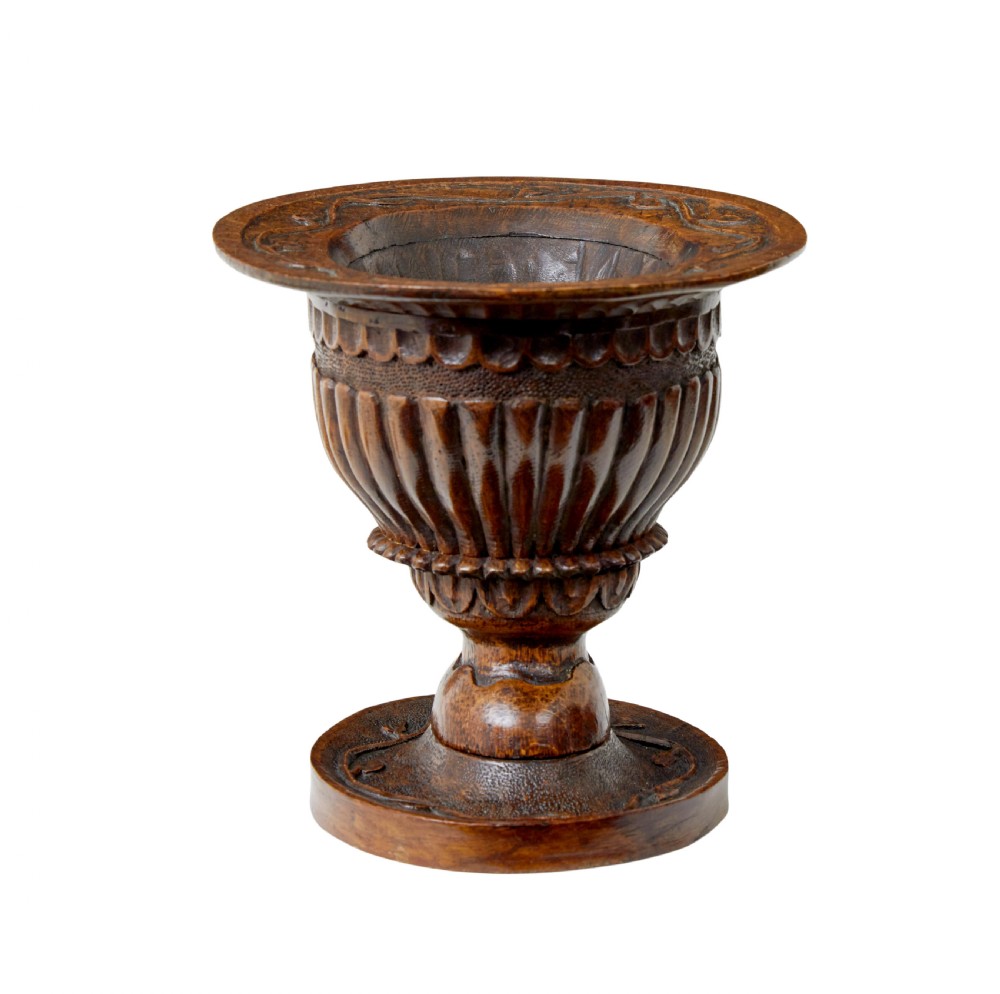 A 19th-century carved oak pedestal bowl featuring deep fluted sides, carved scrollwork along the rim, and a turned circular base. View IV