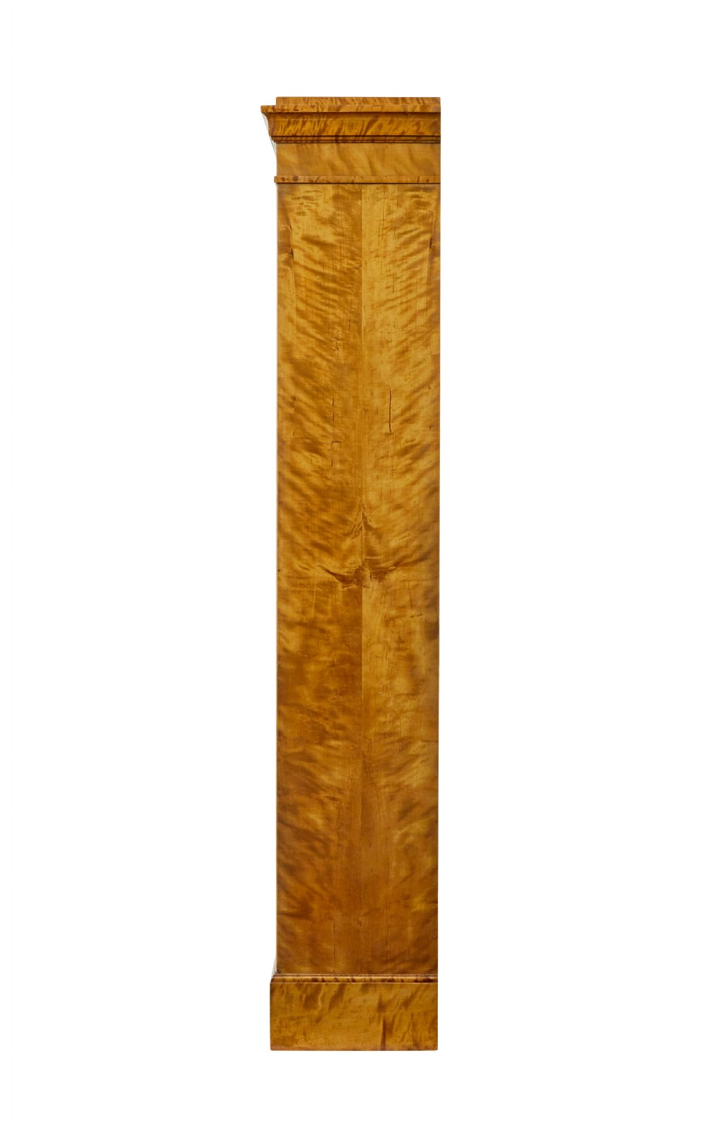 An early 20th-century Swedish Empire Revival open bookcase crafted from golden satin birch with a stepped cornice and ebonised diamond motif. View III