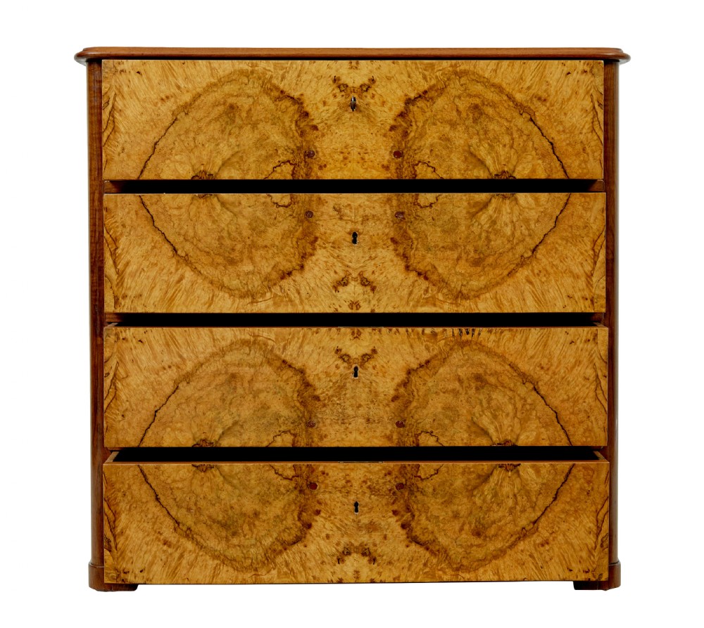 A nineteenth-century Scandinavian burr walnut chest of four drawers featuring symmetrical book-matched grain veneer and rounded side pillars on block feet. View III