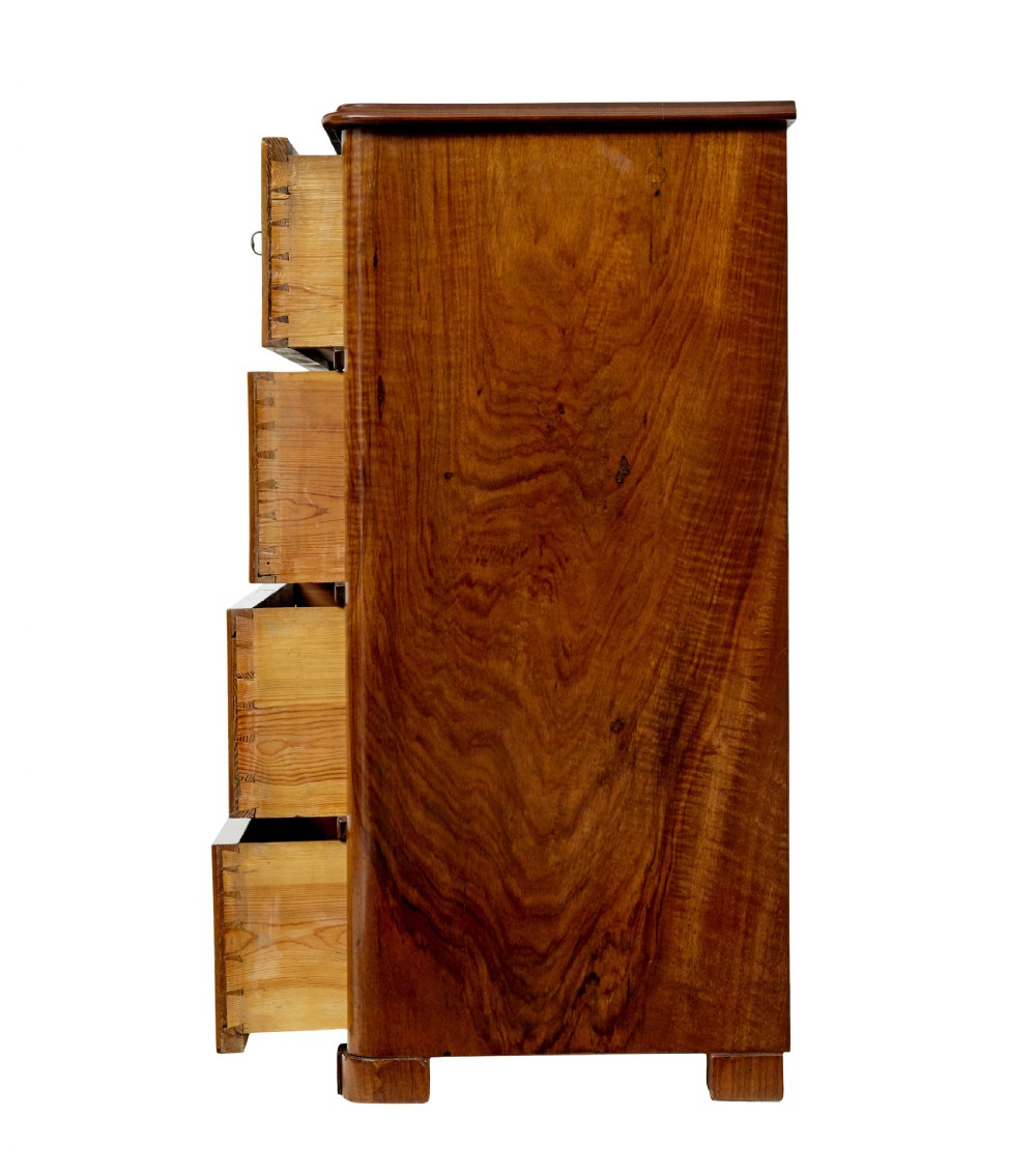 A nineteenth-century Scandinavian burr walnut chest of four drawers featuring symmetrical book-matched grain veneer and rounded side pillars on block feet. View V