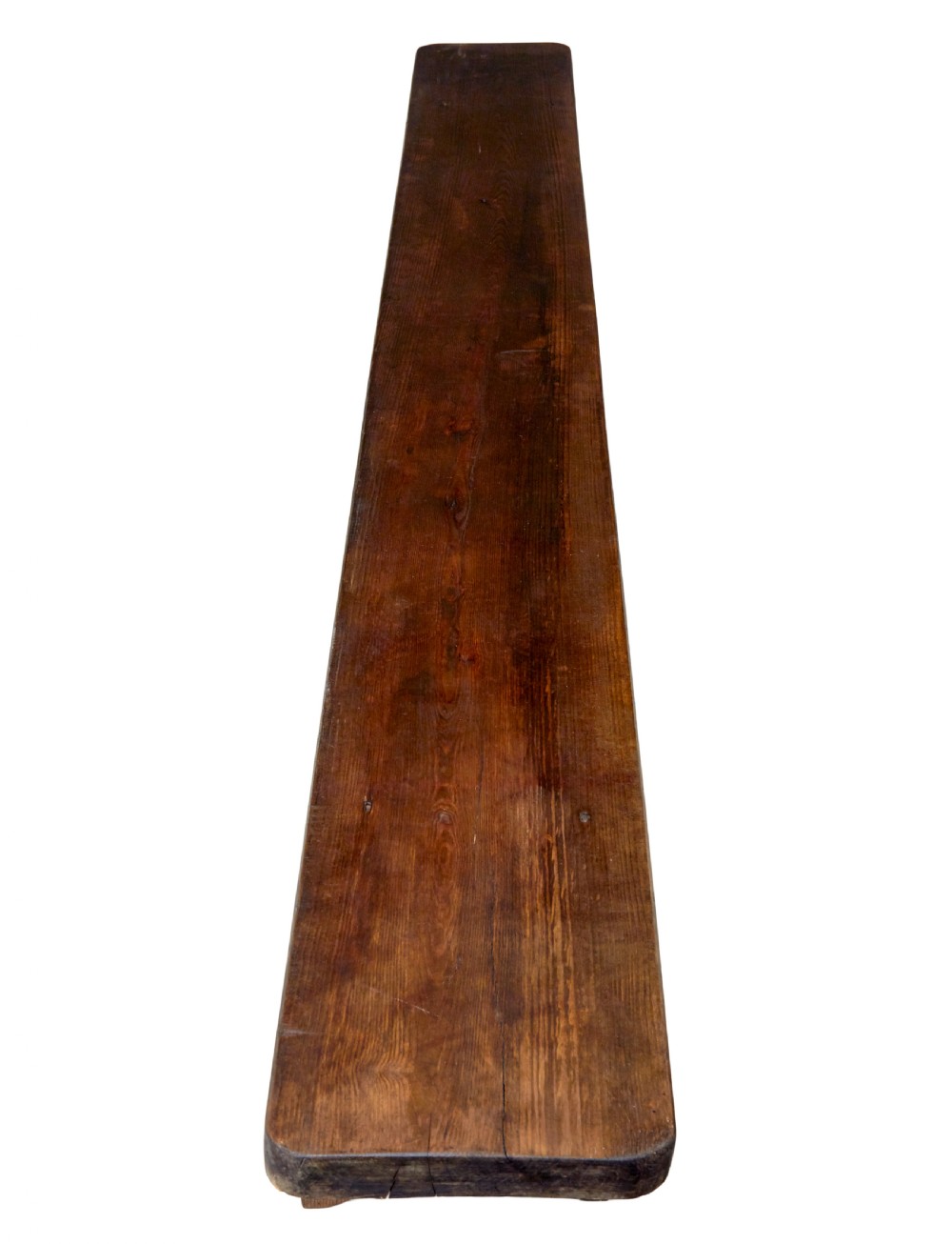 A pair of long early twentieth-century dark pine wooden benches with trestle-style legs. View III