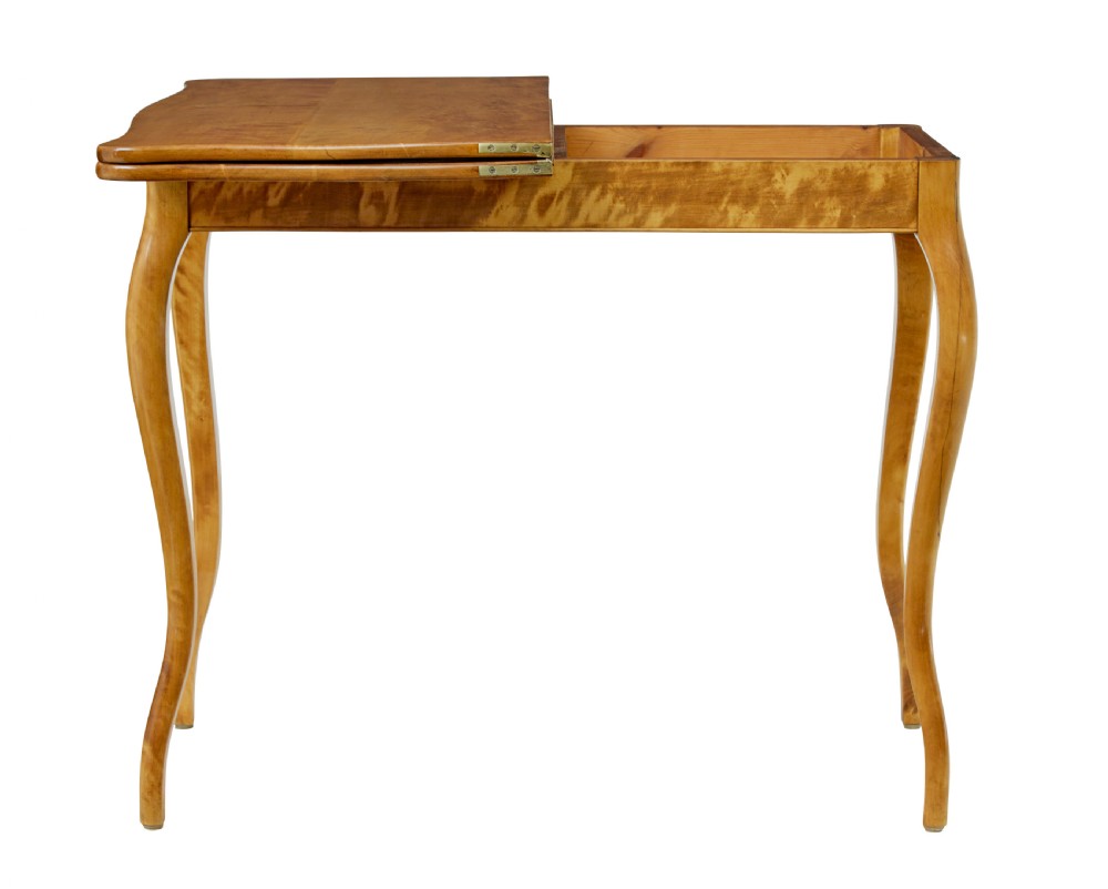 A 19th-century Swedish Rococo Revival tea table crafted from highly figured golden birch with cabriole legs and a fold-over top. View III
