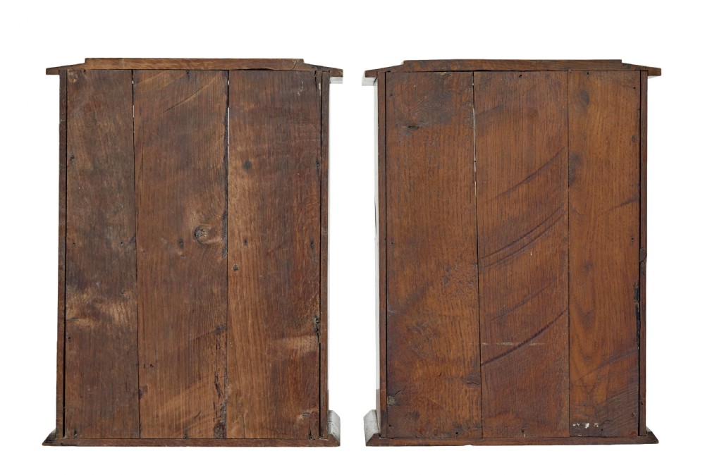 A pair of antique warm brown oak tabletop cabinets featuring glazed doors, brass keyhole escutcheons, and two internal drawers with decorative brass handles. View IV