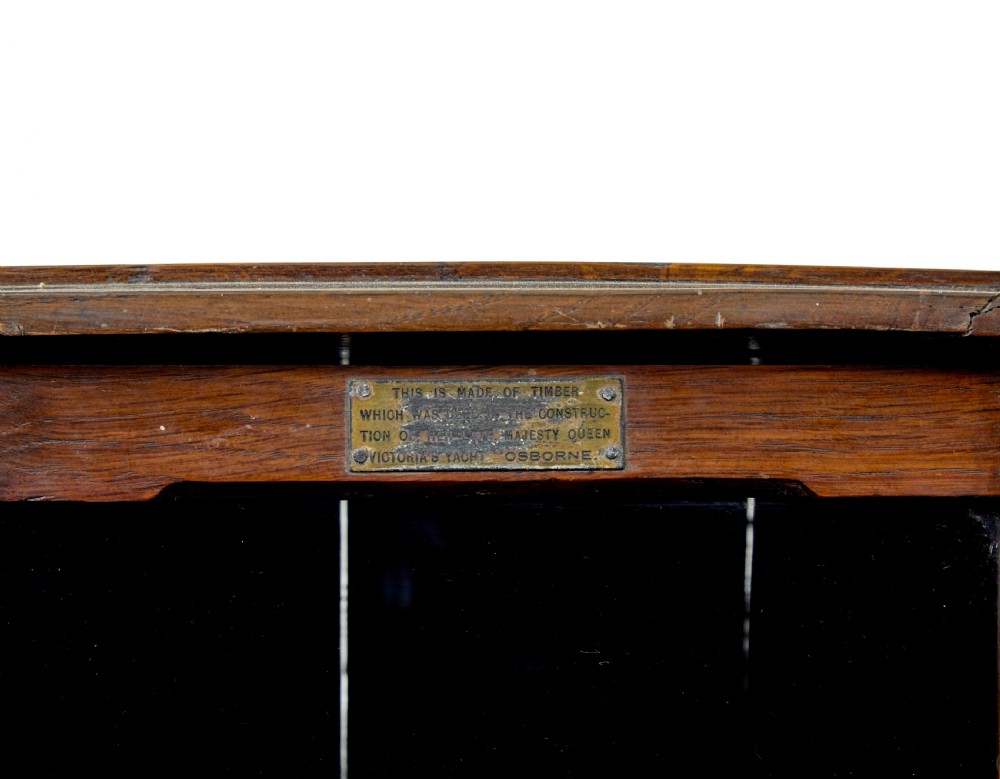 A pair of antique warm brown oak tabletop cabinets featuring glazed doors, brass keyhole escutcheons, and two internal drawers with decorative brass handles. View VI