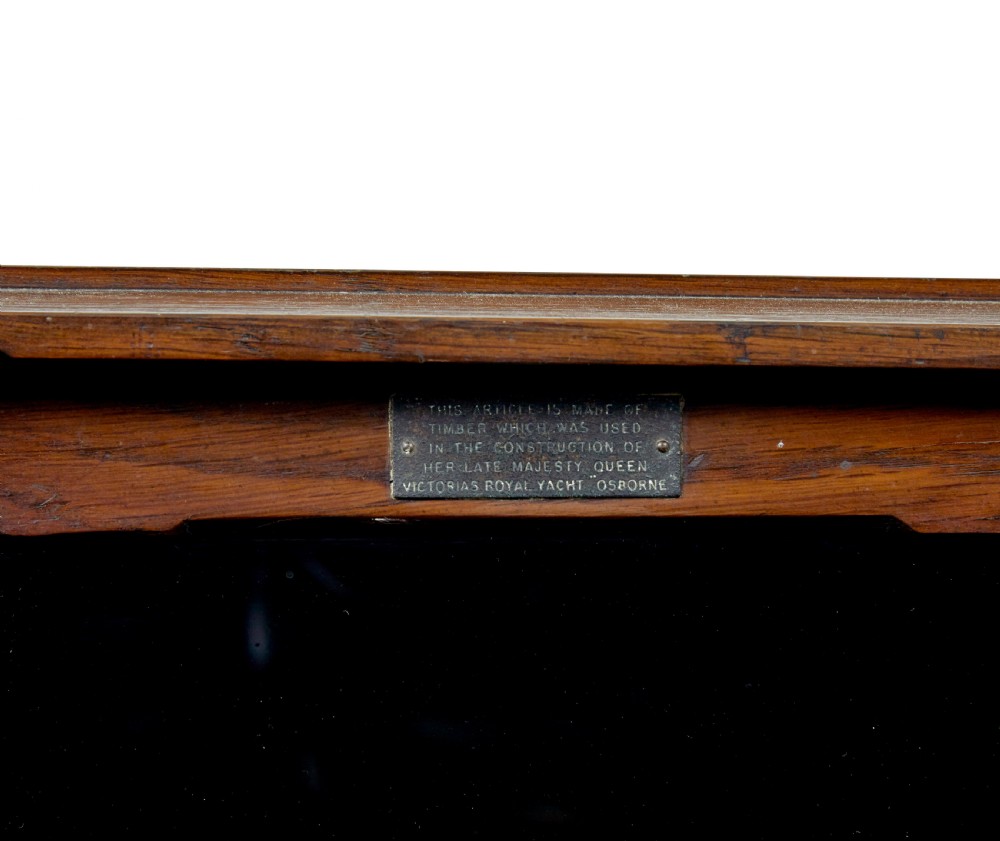 A pair of antique warm brown oak tabletop cabinets featuring glazed doors, brass keyhole escutcheons, and two internal drawers with decorative brass handles. View VII
