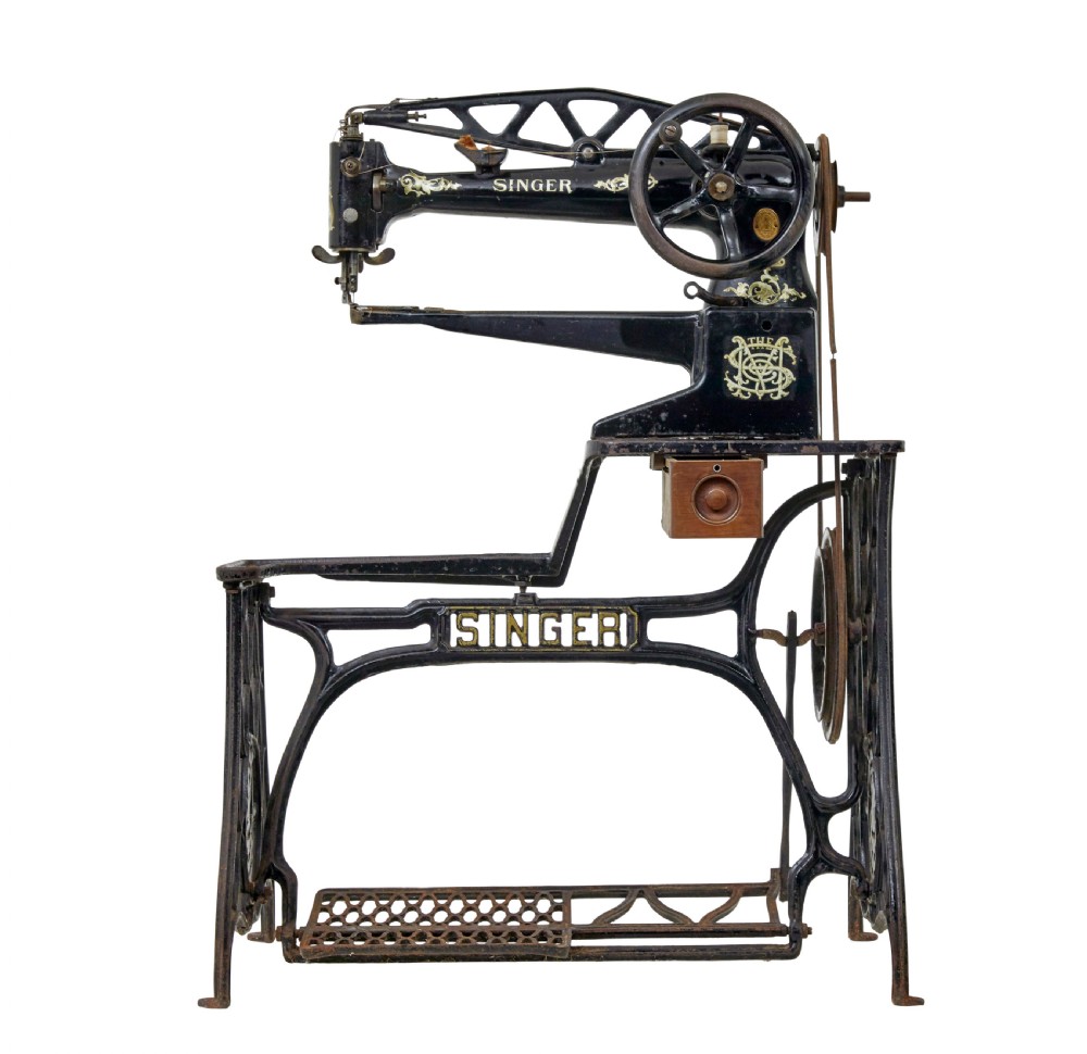 A 19th-century black cast iron Singer industrial treadle sewing machine with openwork frame and gilded lettering. View III