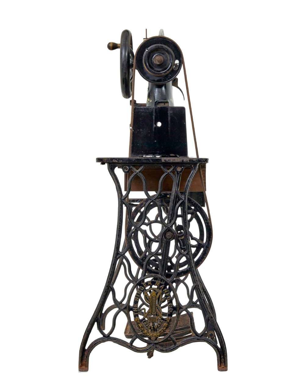 A 19th-century black cast iron Singer industrial treadle sewing machine with openwork frame and gilded lettering. View VI