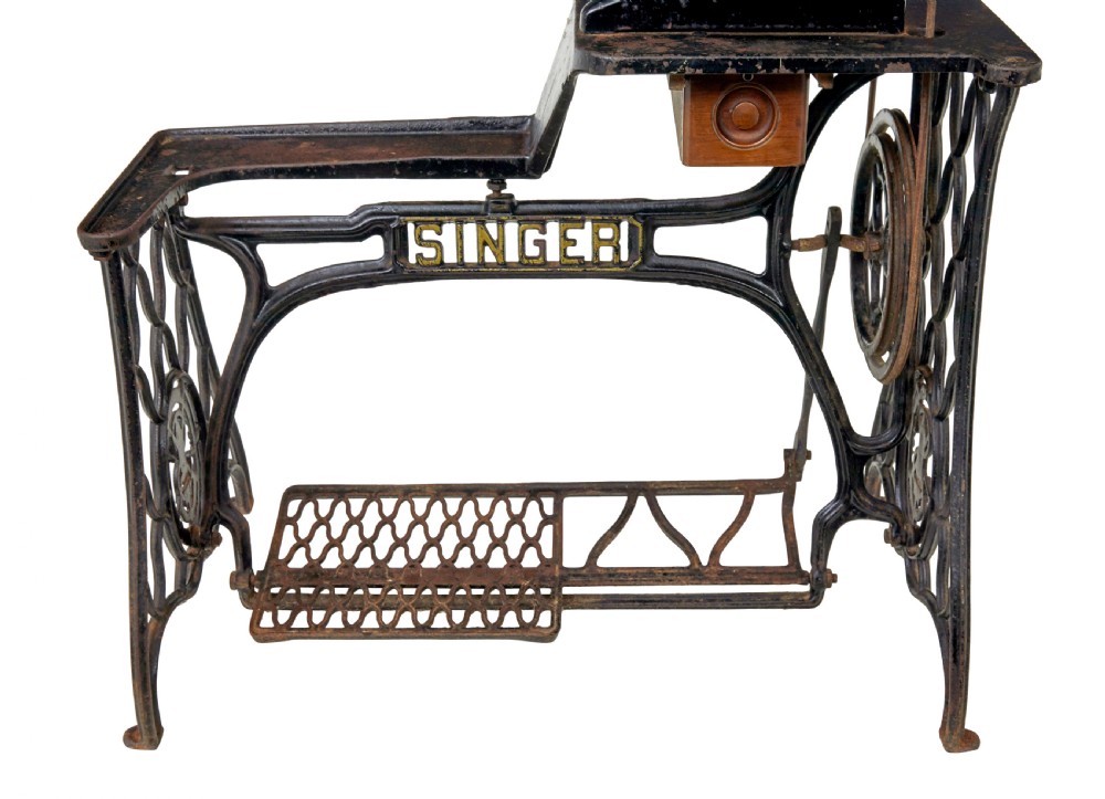 A 19th-century black cast iron Singer industrial treadle sewing machine with openwork frame and gilded lettering. View VIII