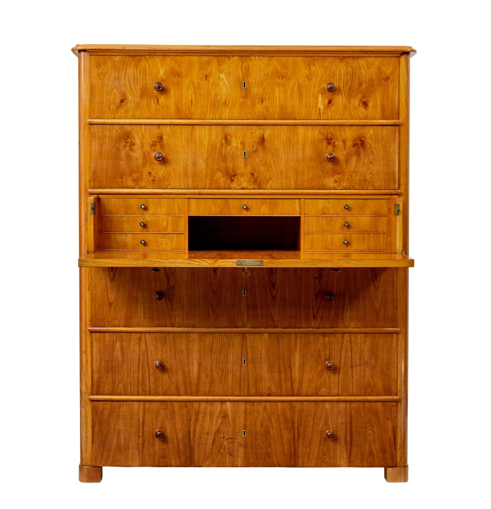 A tall 19th-century elm secretaire chest featuring six graduated drawers with turned wooden knobs and keyhole escutcheons. View III