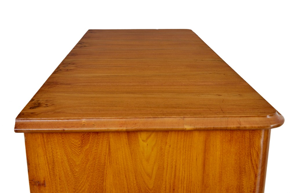 A tall 19th-century elm secretaire chest featuring six graduated drawers with turned wooden knobs and keyhole escutcheons. View XI