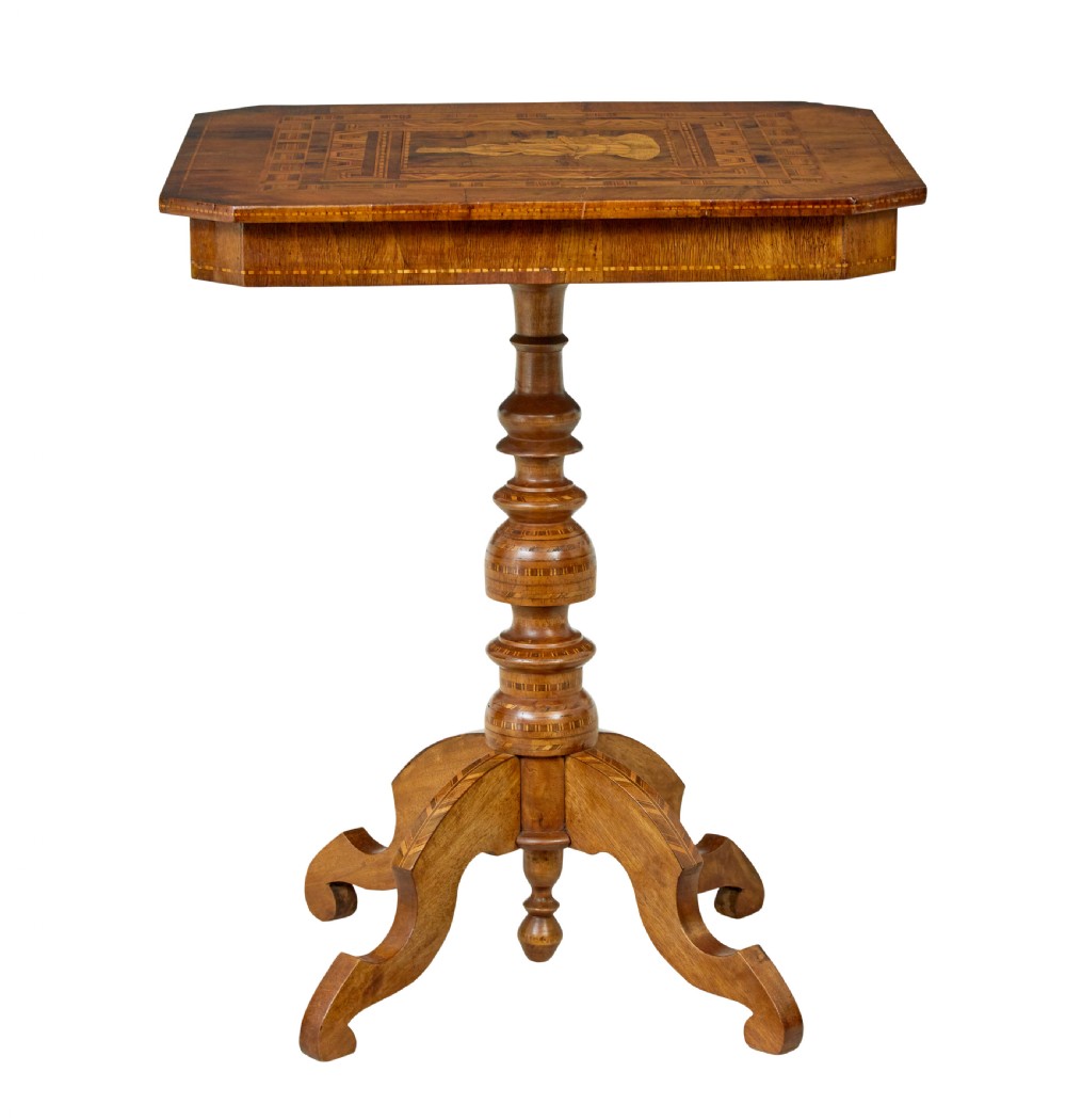 A 19th-century Italian walnut side table featuring an intricate marquetry inlaid top, turned pedestal column, and tripod legs.