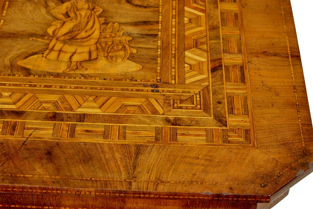 A 19th-century Italian walnut side table featuring an intricate marquetry inlaid top, turned pedestal column, and tripod legs. View IV