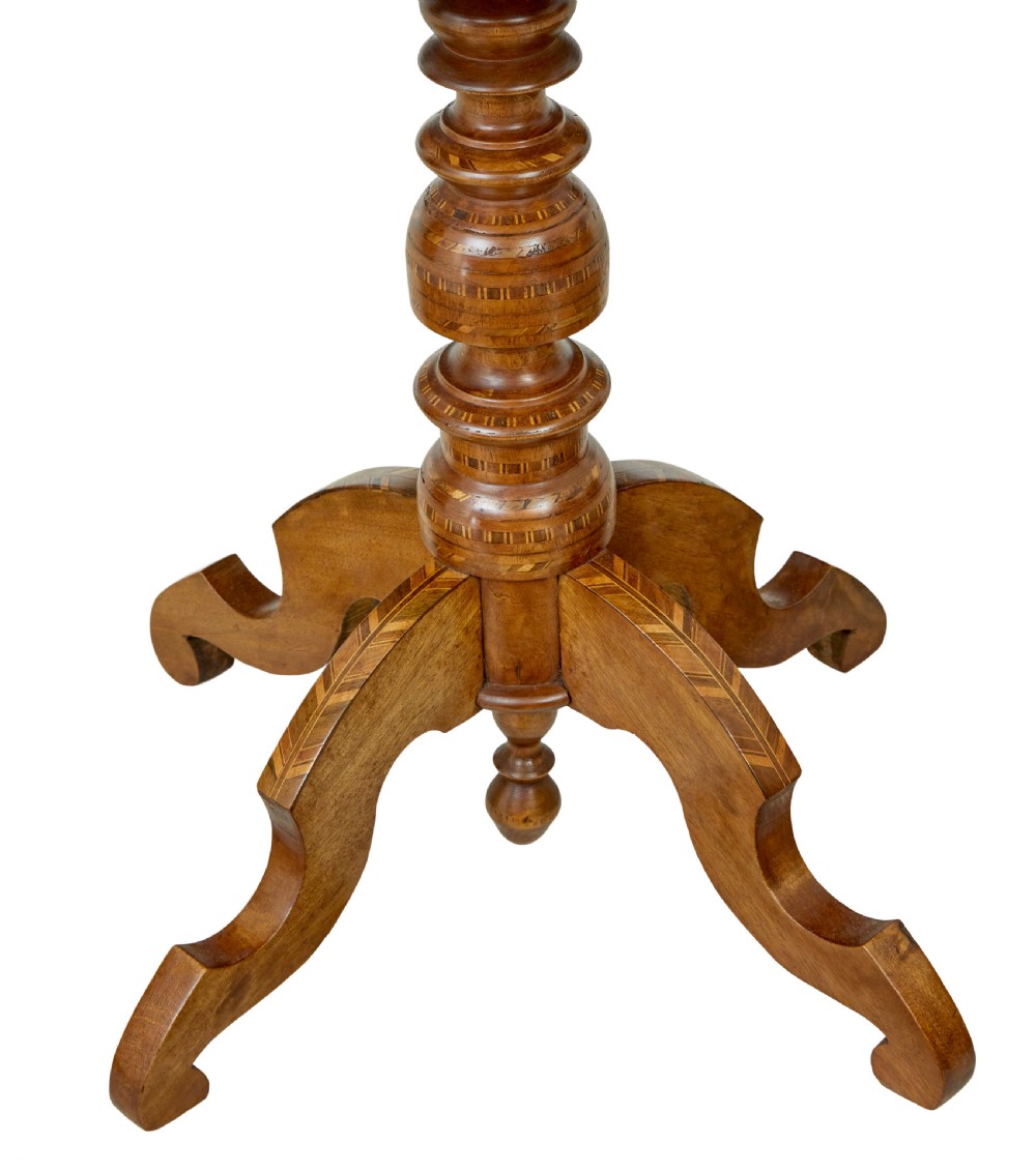 A 19th-century Italian walnut side table featuring an intricate marquetry inlaid top, turned pedestal column, and tripod legs. View VI
