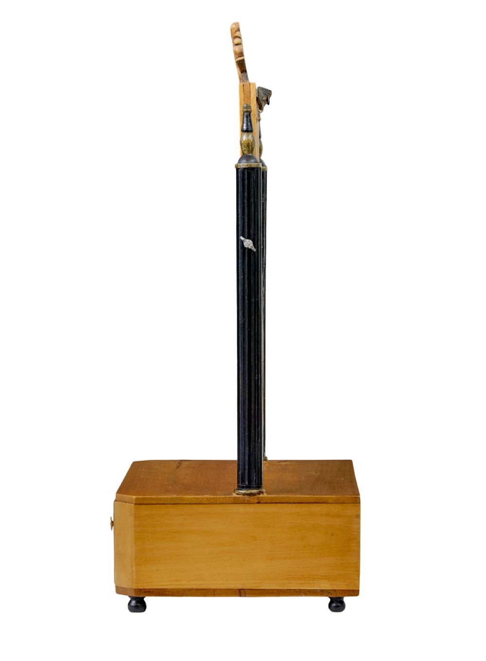 A 19th-century Swedish light birch tabletop vanity mirror featuring a carved top crest, ebonised side columns with brass finials, and a base drawer on bun feet. View IV