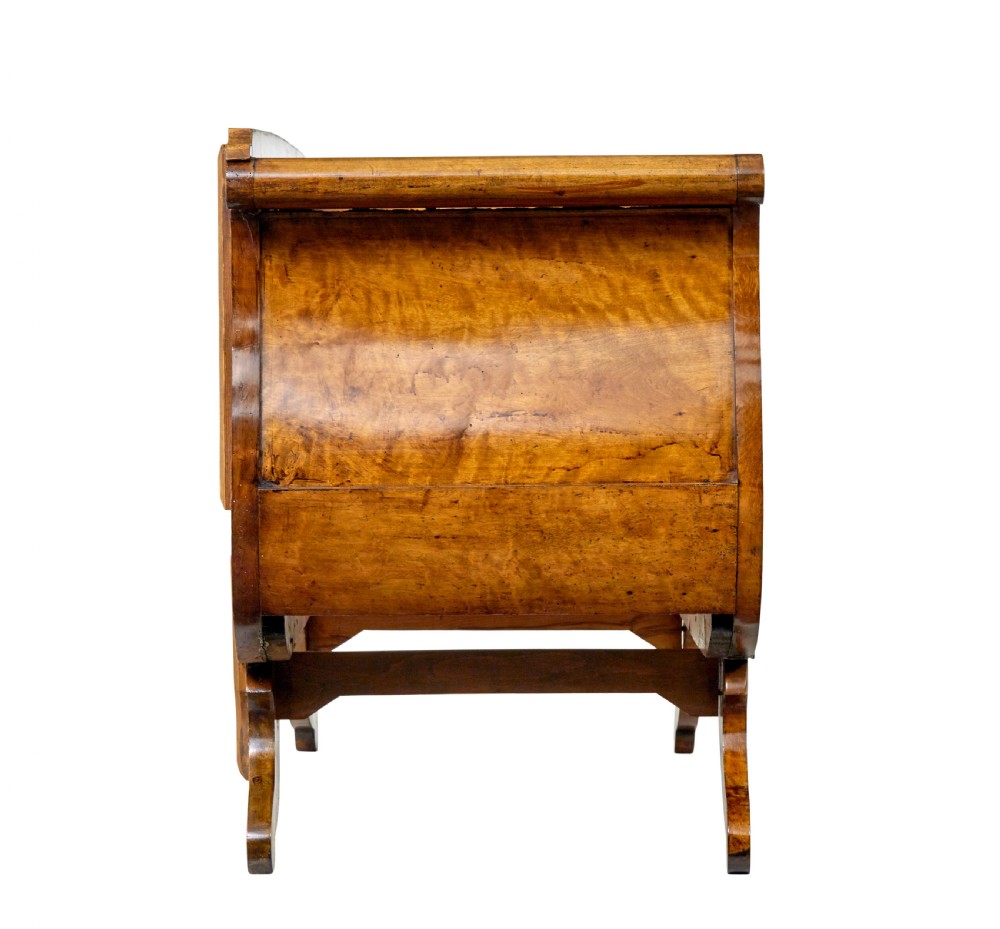 A 19th-century Swedish Empire sofa crafted from golden birch with scrolled ends and splayed legs, featuring geometric pattern textile upholstery. View II