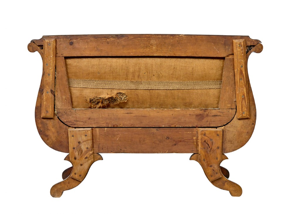 A 19th-century Swedish Empire sofa crafted from golden birch with scrolled ends and splayed legs, featuring geometric pattern textile upholstery. View III