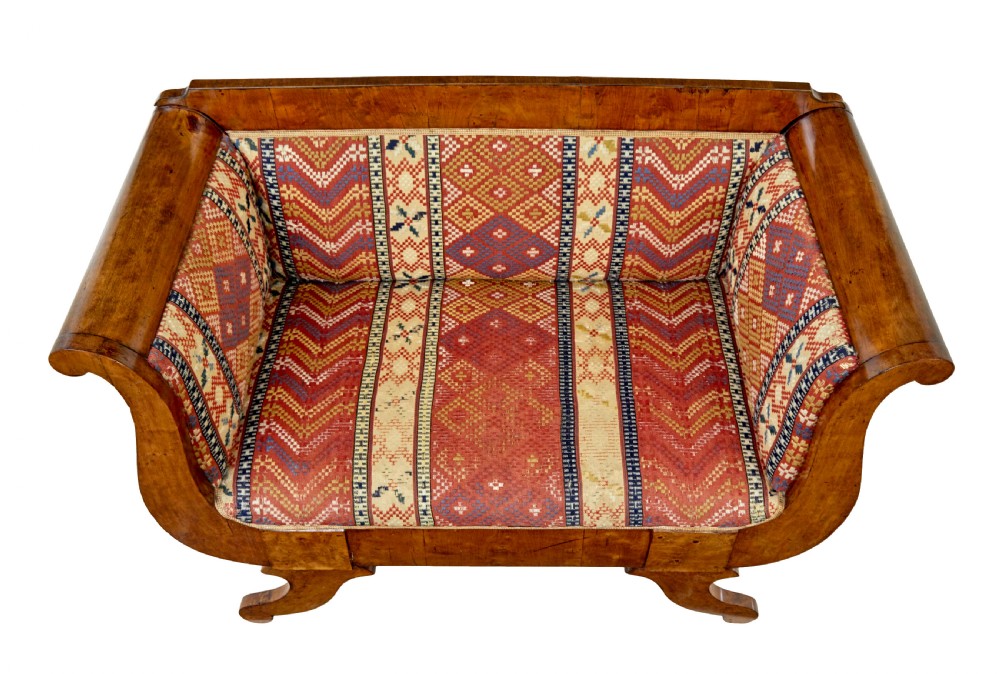 A 19th-century Swedish Empire sofa crafted from golden birch with scrolled ends and splayed legs, featuring geometric pattern textile upholstery. View VII