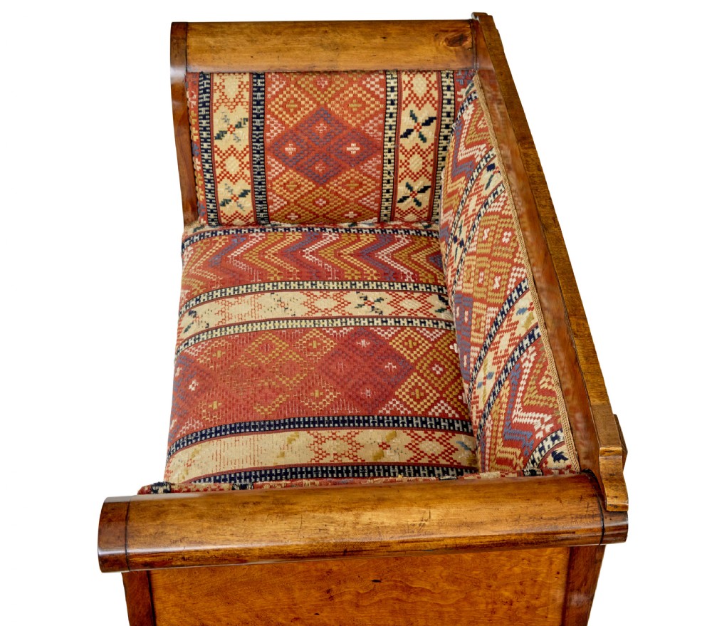 A 19th-century Swedish Empire sofa crafted from golden birch with scrolled ends and splayed legs, featuring geometric pattern textile upholstery. View VIII
