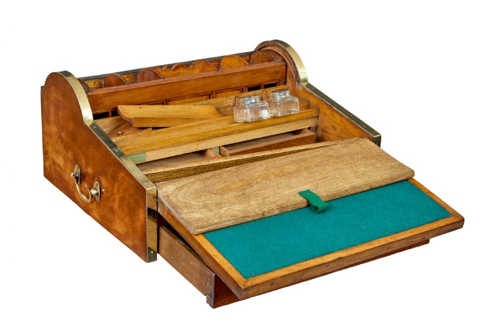 A 19th-century camphor wood campaign writing slope featuring a slatted tambour top, brass corner strapping, side carrying handles, and line inlay details. View IV