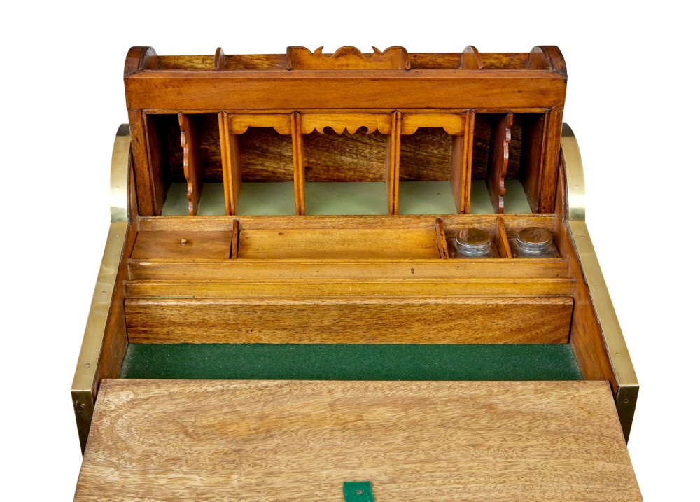 A 19th-century camphor wood campaign writing slope featuring a slatted tambour top, brass corner strapping, side carrying handles, and line inlay details. View VI