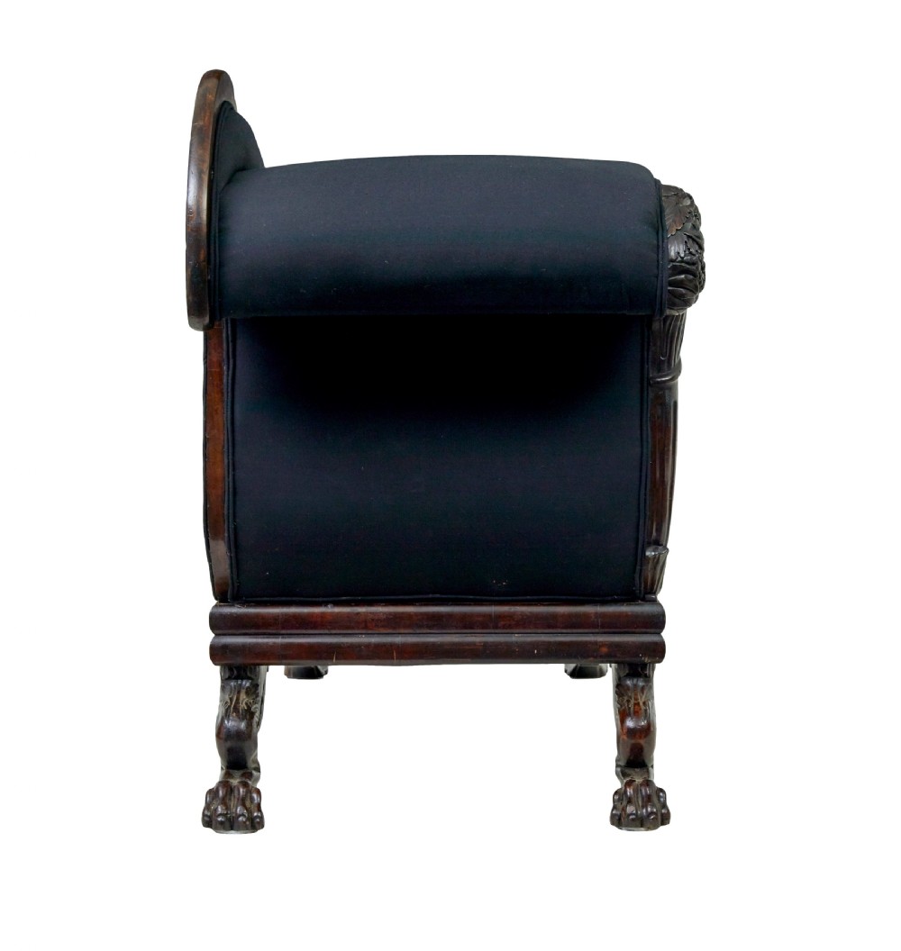 A 19th-century William IV mahogany chaise longue with hand-carved scroll detailing and dark fabric upholstery. View III