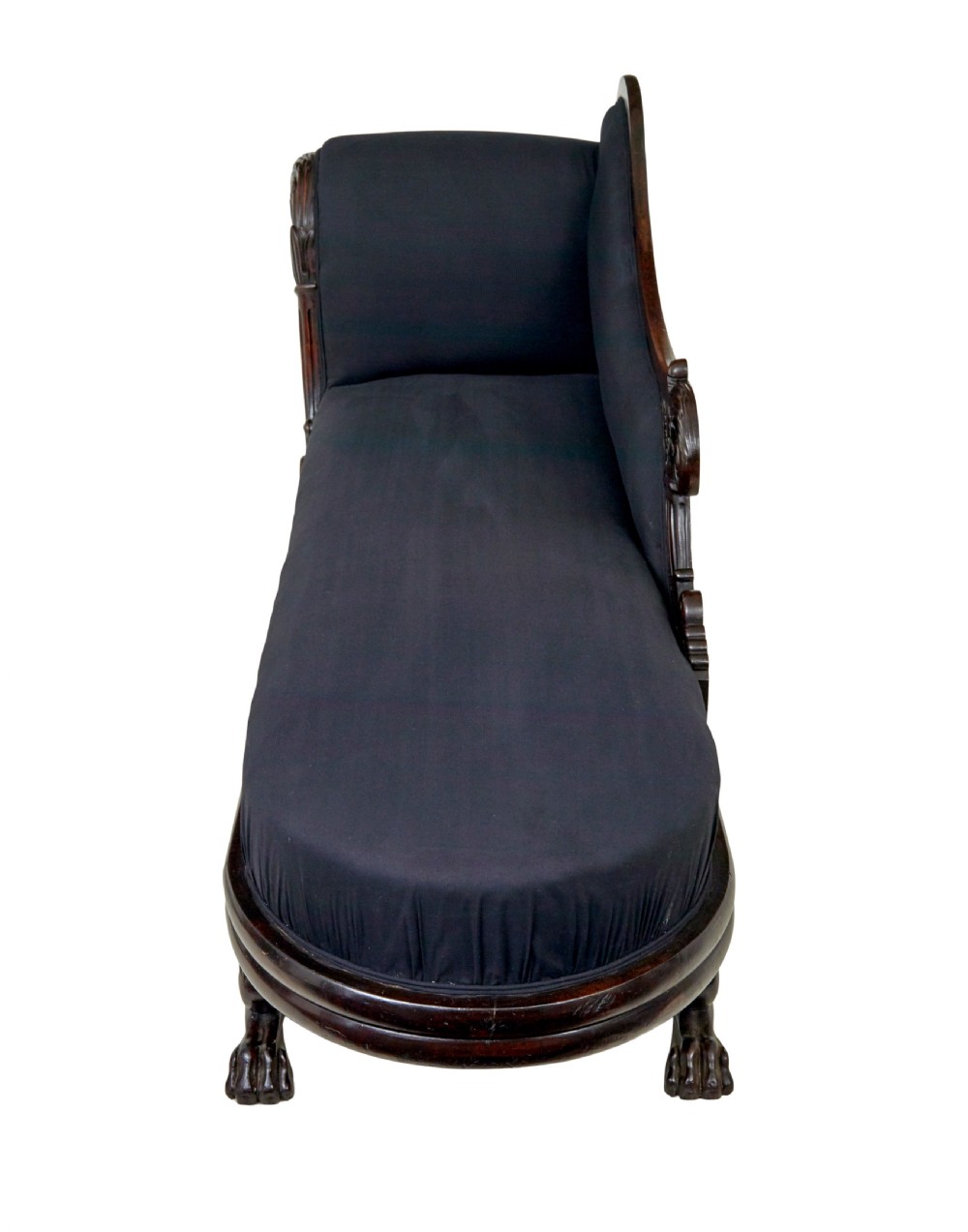 A 19th-century William IV mahogany chaise longue with hand-carved scroll detailing and dark fabric upholstery. View XI