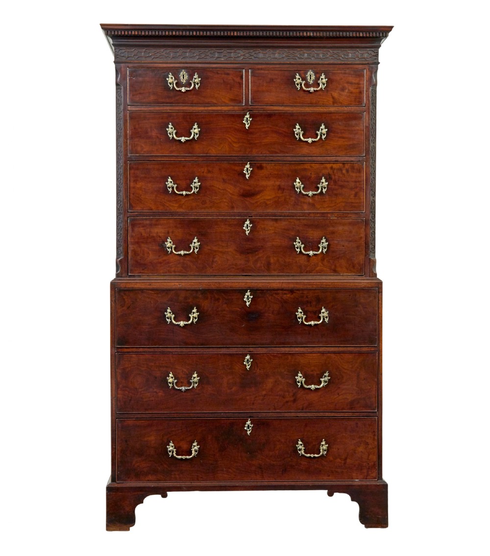 An early nineteenth-century Georgian mahogany chest on chest featuring bracket feet, brass swan-neck handles, and two stacked sections of graduated drawers. View II