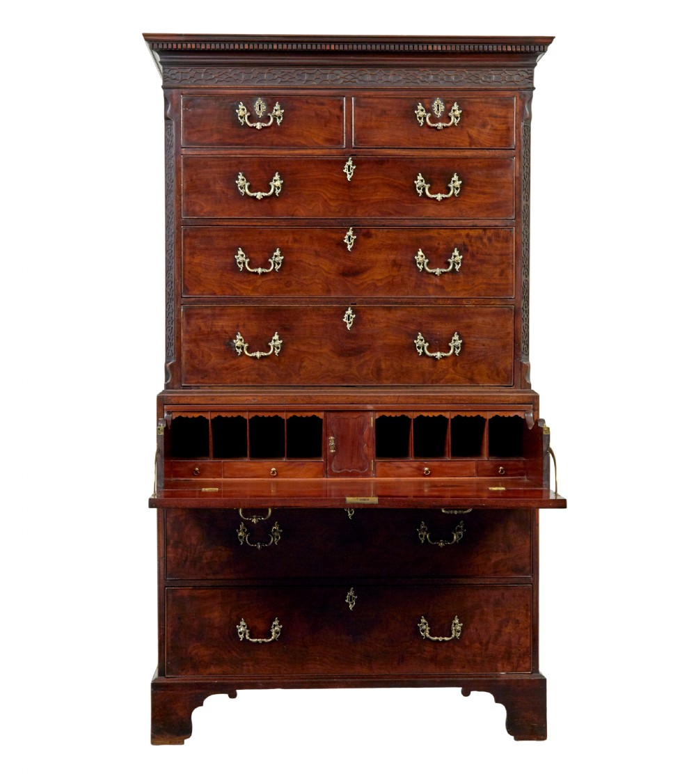 An early nineteenth-century Georgian mahogany chest on chest featuring bracket feet, brass swan-neck handles, and two stacked sections of graduated drawers. View V
