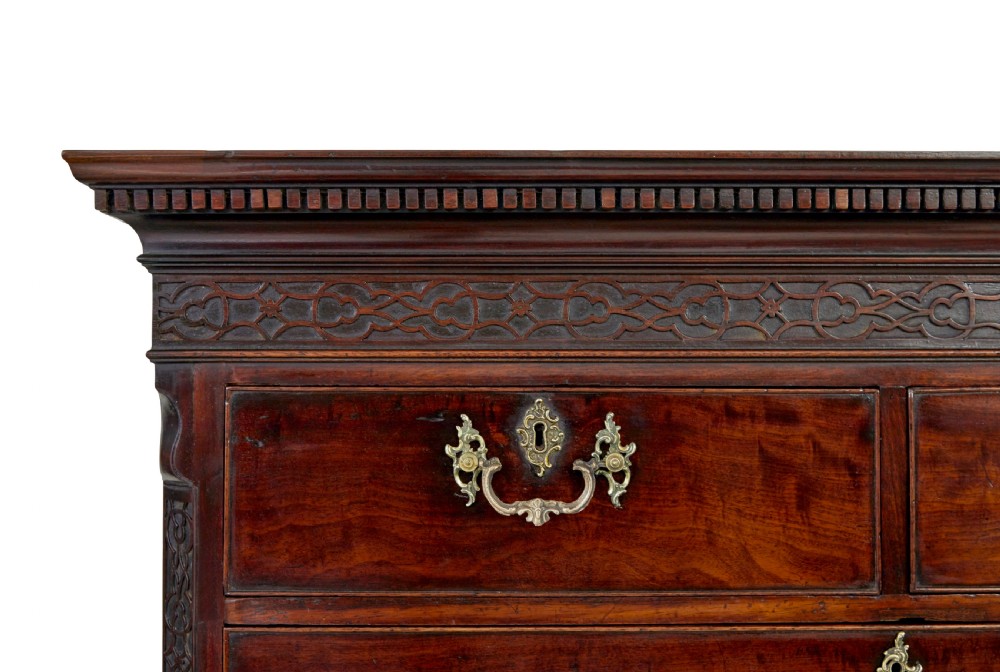An early nineteenth-century Georgian mahogany chest on chest featuring bracket feet, brass swan-neck handles, and two stacked sections of graduated drawers. View IX