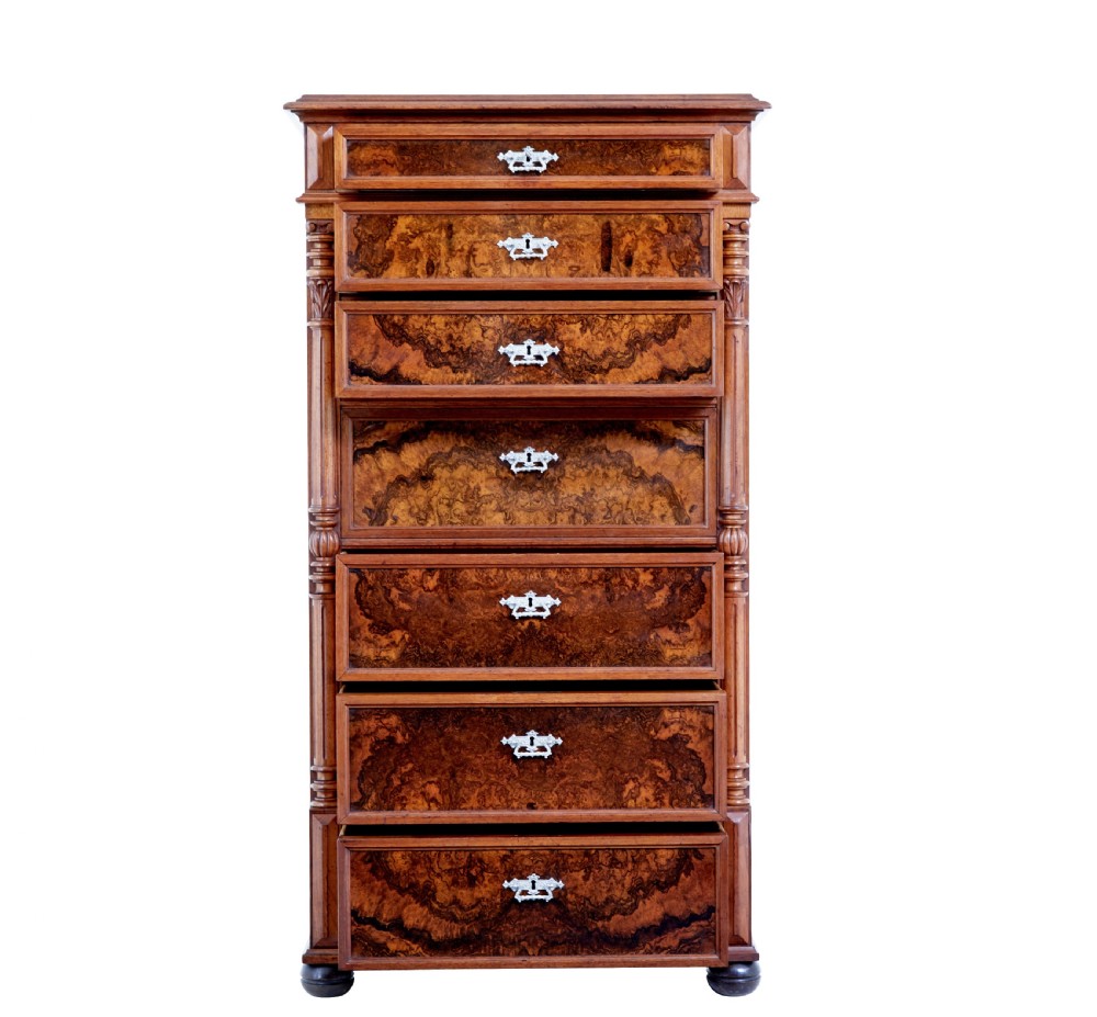 A tall 19th-century burr walnut secretaire chest of drawers featuring bookmatched veneer drawer fronts, fluted side columns, and ornate metal escutcheons. View III