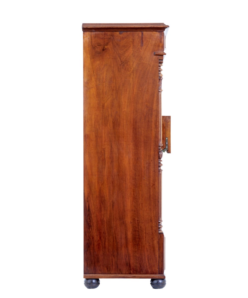 A tall 19th-century burr walnut secretaire chest of drawers featuring bookmatched veneer drawer fronts, fluted side columns, and ornate metal escutcheons. View VIII