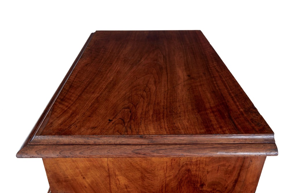 A tall 19th-century burr walnut secretaire chest of drawers featuring bookmatched veneer drawer fronts, fluted side columns, and ornate metal escutcheons. View XIV