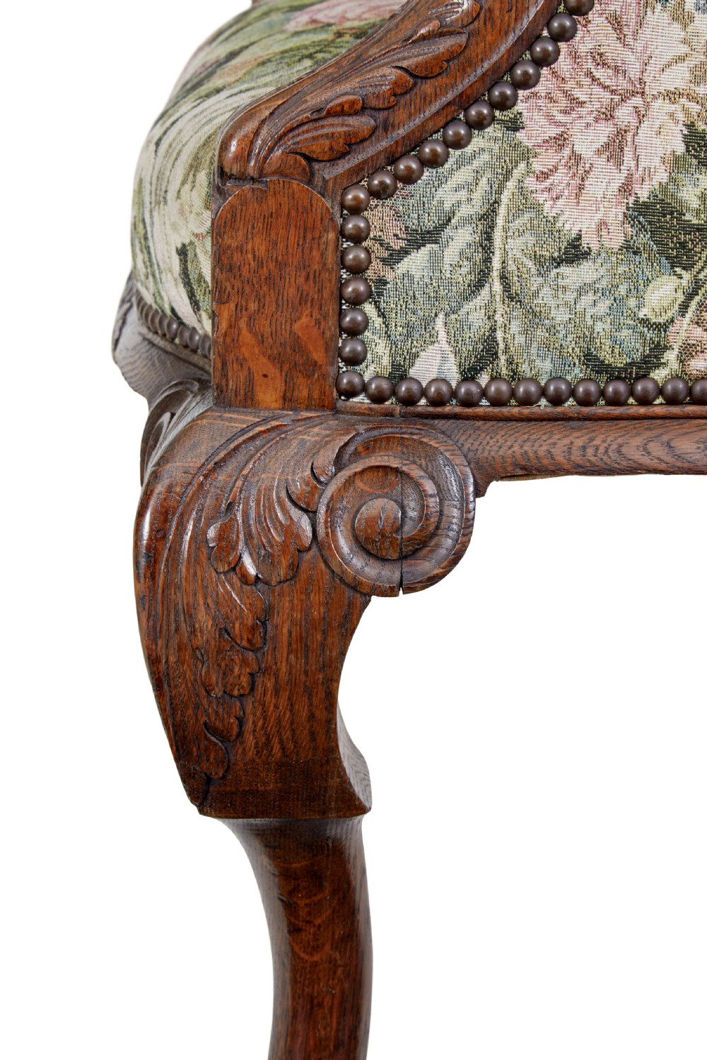 A pair of 19th-century French carved oak armchairs upholstered in a green floral tapestry fabric with carved lion-head armrests. View XI