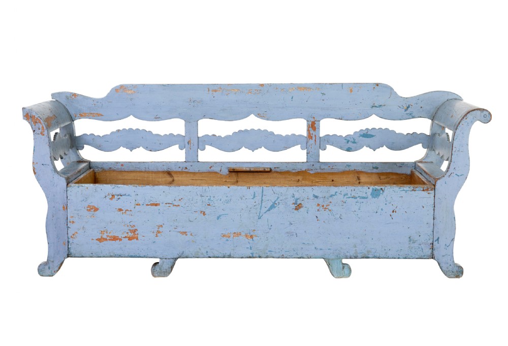 A mid 19th-century Swedish wooden storage bench featuring a distressed light blue painted finish, scalloped backrest rails, and flared armrests. View III