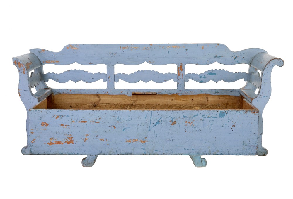 A mid 19th-century Swedish wooden storage bench featuring a distressed light blue painted finish, scalloped backrest rails, and flared armrests. View IV