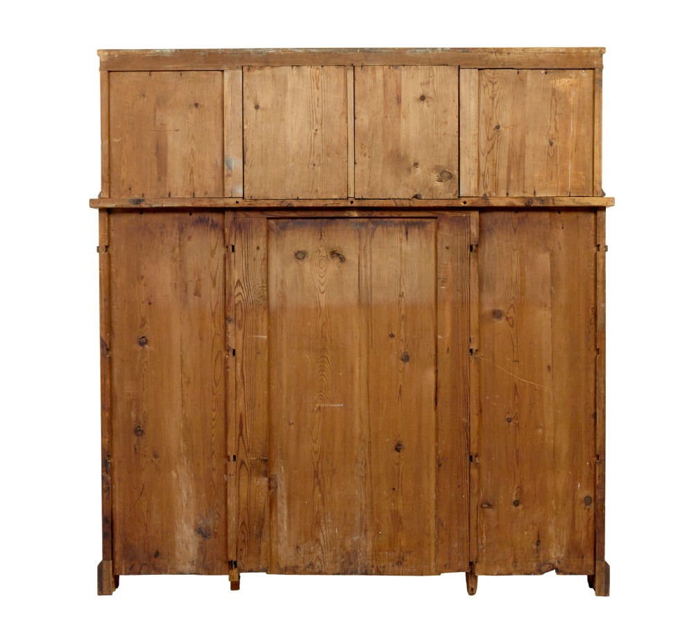 A mid-19th-century Swedish satin birch buffet sideboard featuring a lower three-door cabinet with carved petal applied mouldings and an upper tiered superstructure with Gothic arch cabinet doors. View V