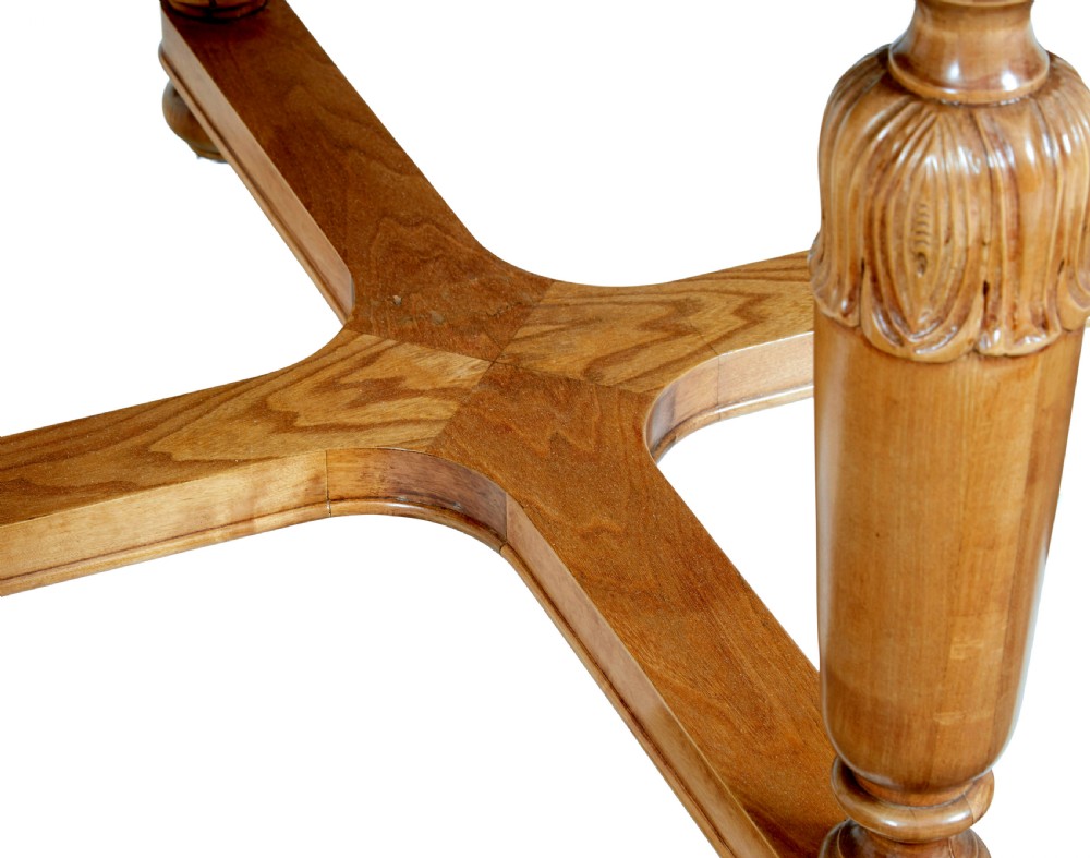 A low circular Art Deco coffee table crafted from light golden birch with an inlaid central panel and carved legs connected by an X-frame stretcher. View VI