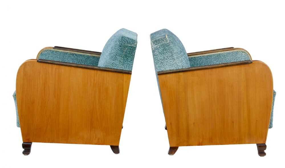 A pair of Swedish Art Deco armchairs featuring curved blonde wood arms, teal textured fabric upholstery, and dark block feet. View IV