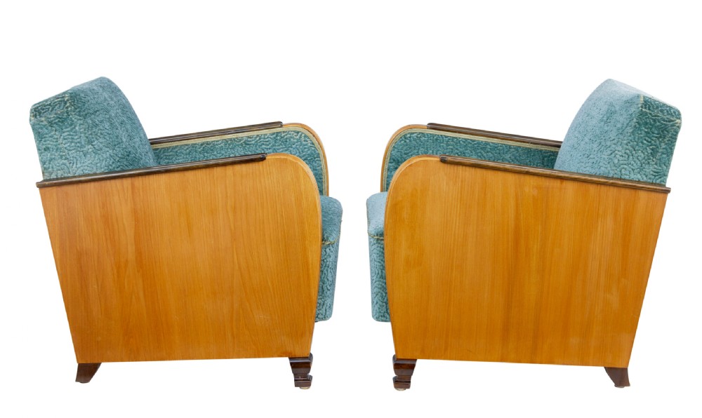 A pair of Swedish Art Deco armchairs featuring curved blonde wood arms, teal textured fabric upholstery, and dark block feet. View V